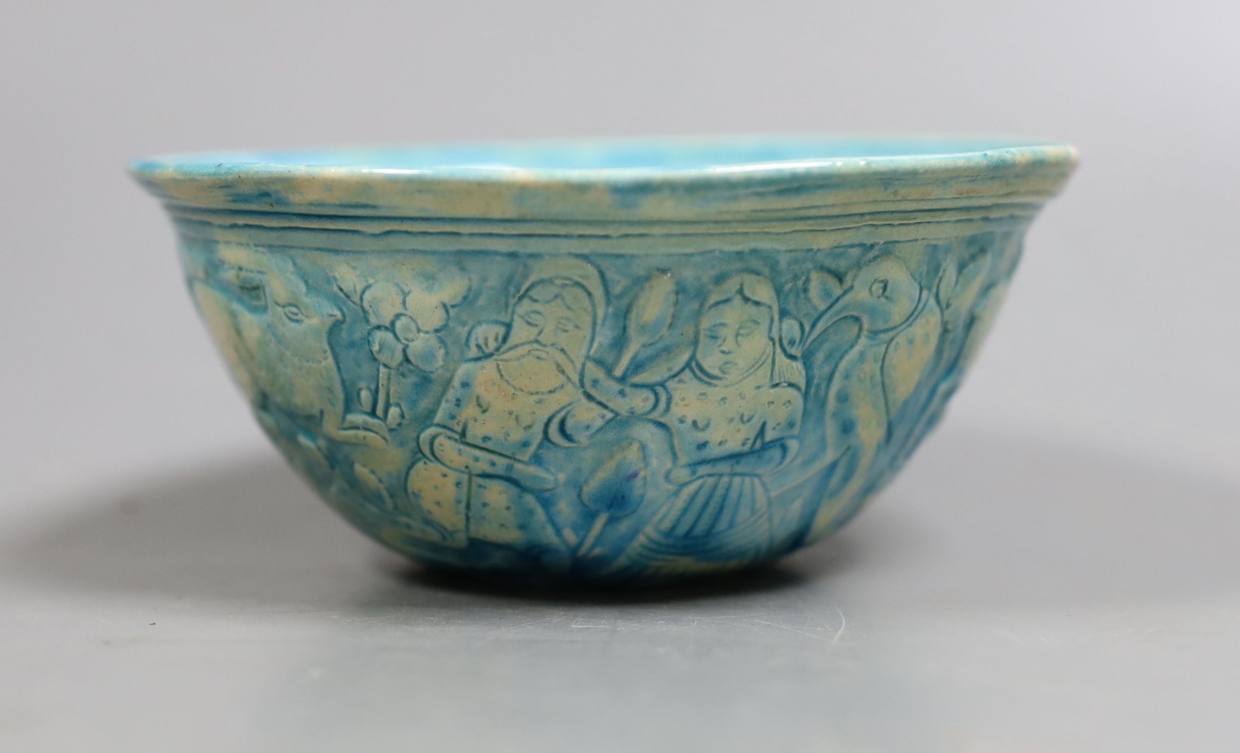 A Persian turquoise glazed fritware bowl, 12.5 cms diameter.